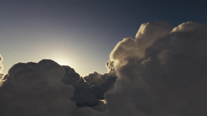 Sunlight is shining through the cumulus clouds