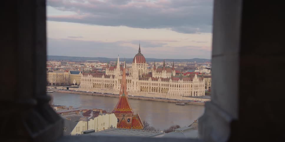 View of Hungarian Parliament building in Budapest over the Danube River through a window