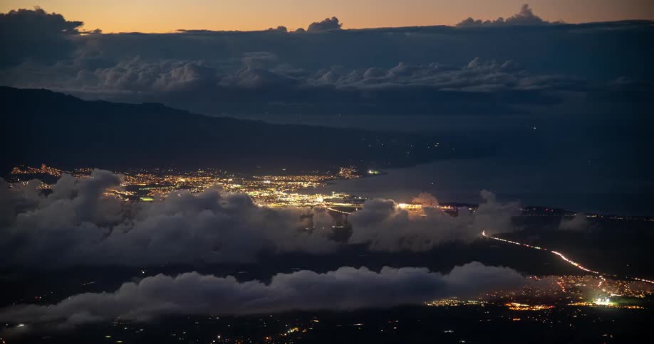 Time lapse of clouds passing over a large coastal city