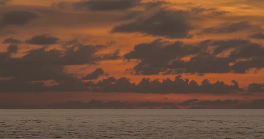 Time lapse of a sunset over a calm ocean
