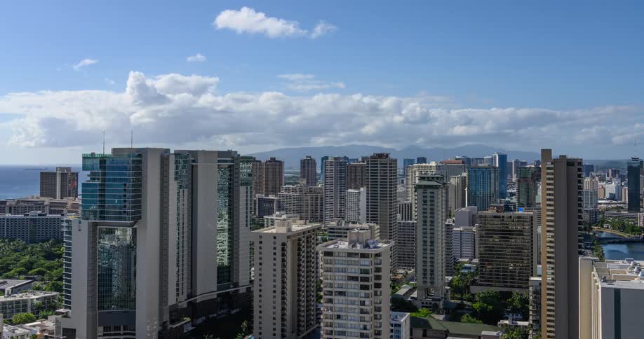 Timelapse of clouds moving over the city on a clear day