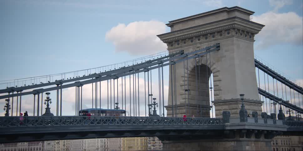 Traffic crosses Szechenyi Chain bridge in Budapest on a cloudy day