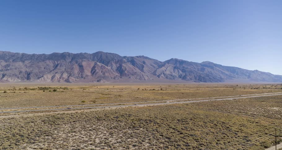 Cars travel on the roads by the mountains