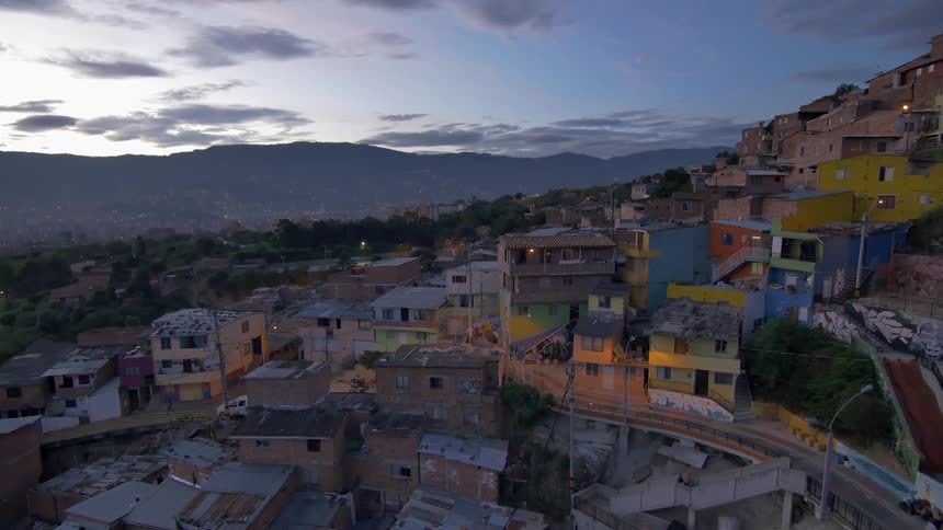 Houses of many colors spread up a hill