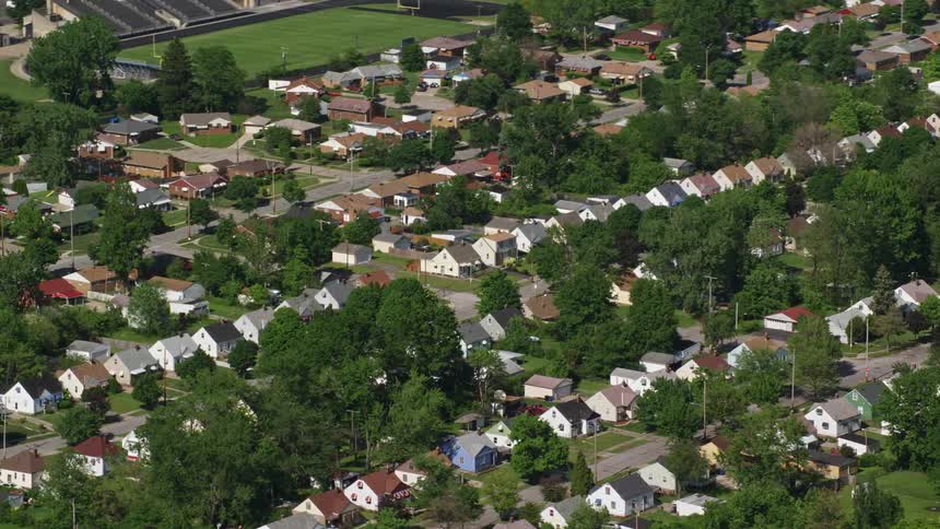 Aerial view of a residential neighborhood with tree vegetation