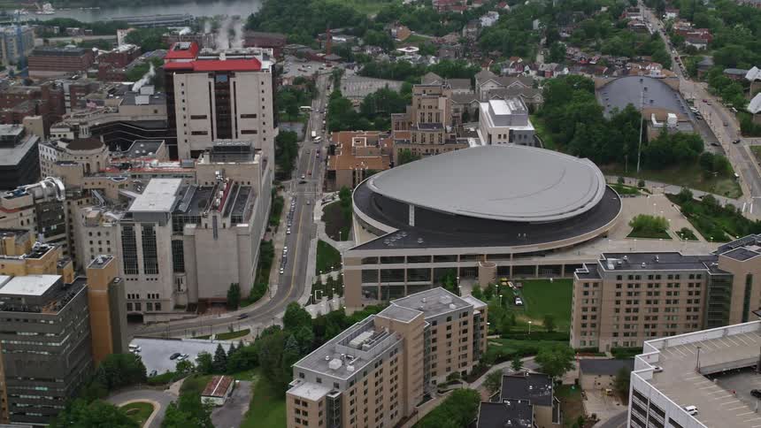Aerial panorama of a closed stadium in the middle of a metropolitan city