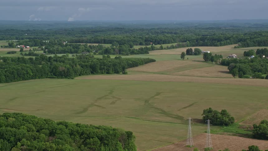 Aerial scenery of agricultural fields forestry and rural areas on a blue sky day