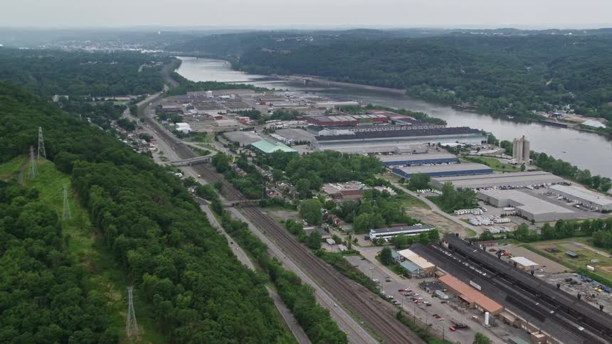 Aerial view of a neighborhood near an industrial area in a small town
