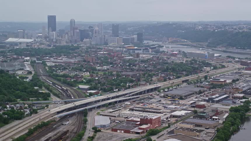 Aerial scenery of a metropolis with skyscrapers highway with vehicle traffic and a sea canal