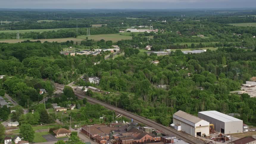 Aerial view of a small town in a lush green rural area