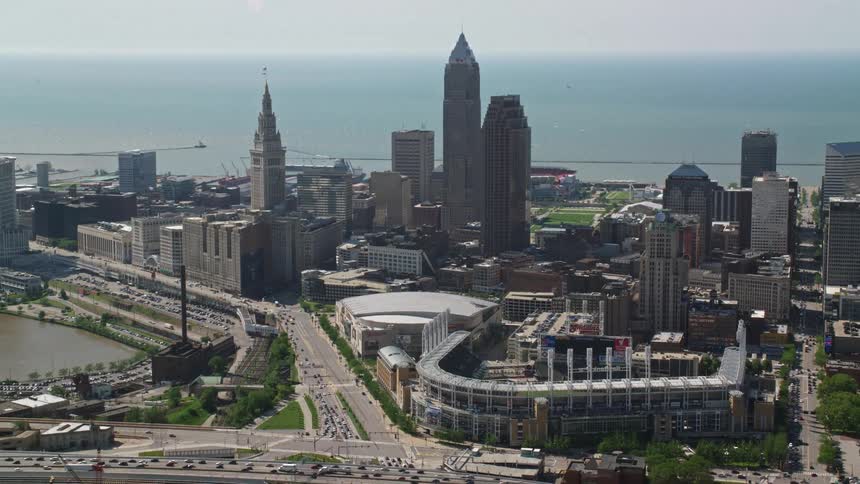 Aerial panorama of a metropolitan city with a skyscraper sports stadiums and the seafront