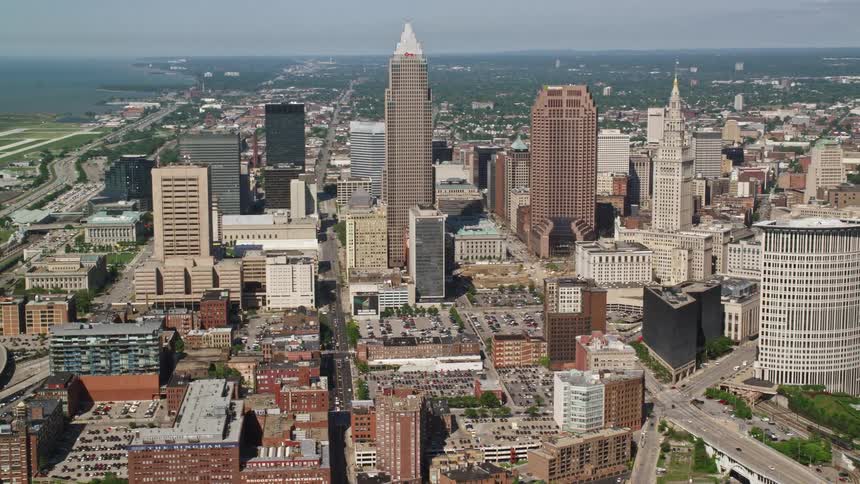 Aerial of a metropolis next to an ocean coast on a summer day