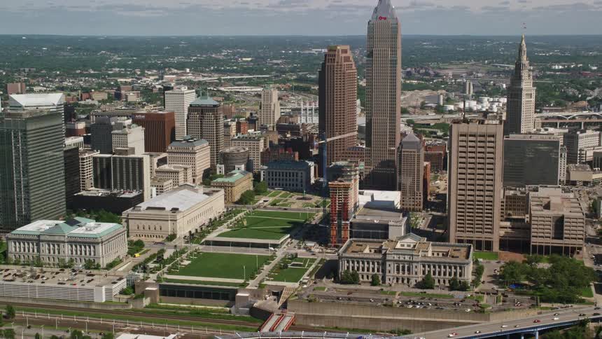 Aerial panorama of a metropolis with a skyscraper commercial buildings sports stadium during the day