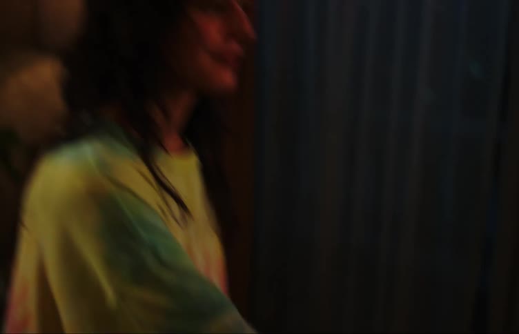 Two friends dance together at home