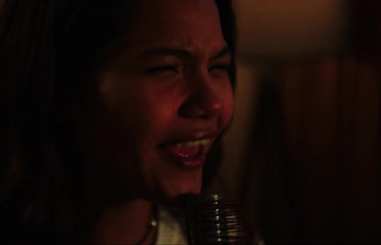 Two young women singing together