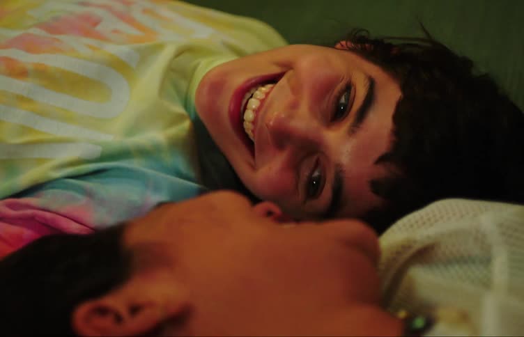 Two women laugh on the ground