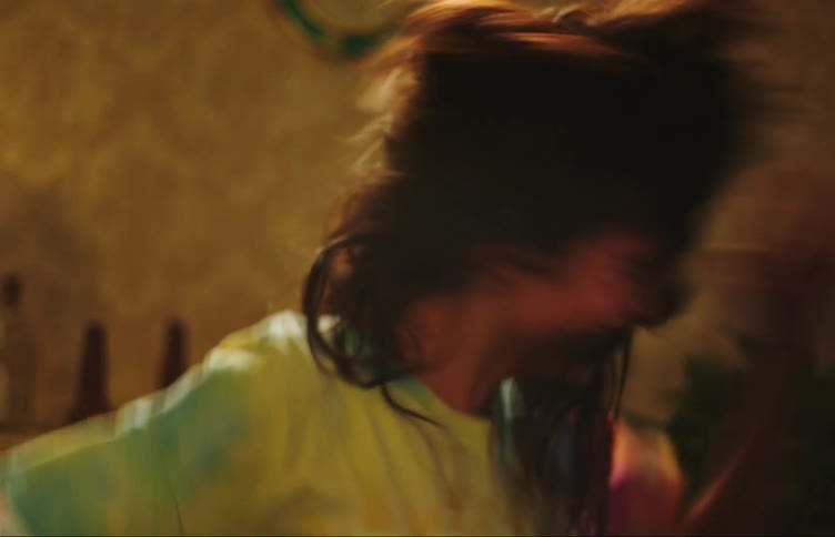 Two young teenage girls dancing happily in the room indoors at night