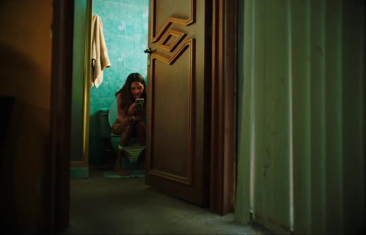 A clip of a lady using the toilet