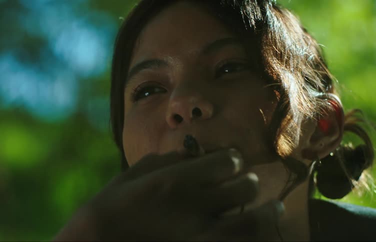 Portrait of a woman taking out a cigarette and smoking