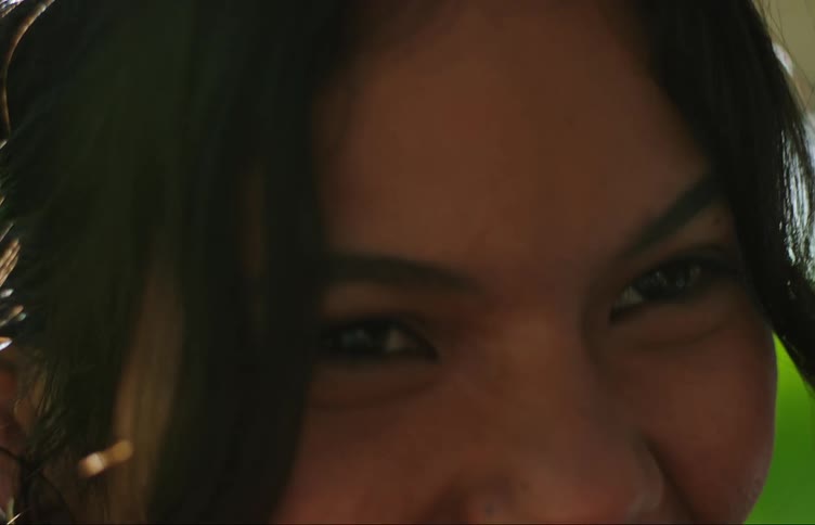 Portrait of a young woman smiling and smoking