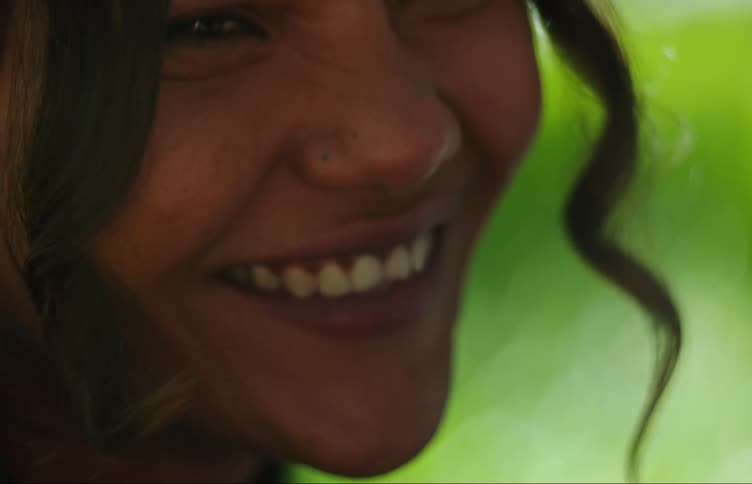 Portrait of a young man and woman smiling and smoking