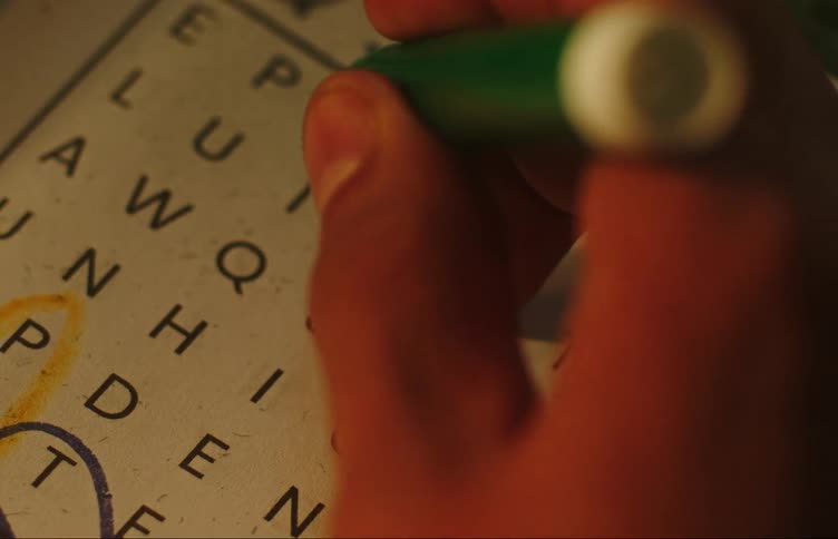 A person solving a crossword puzzle