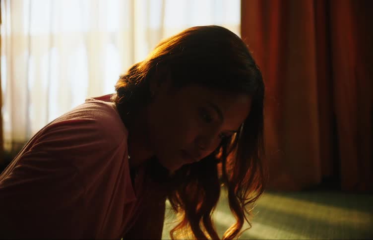 A lady laying on the floor and studying