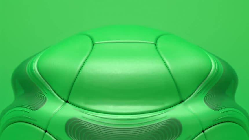 Close up of moving ripples on the exterior of a green soccer ball