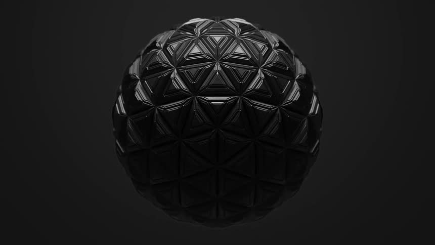 Smooth surface of dark gray ball transforms into a textured geometric pattern