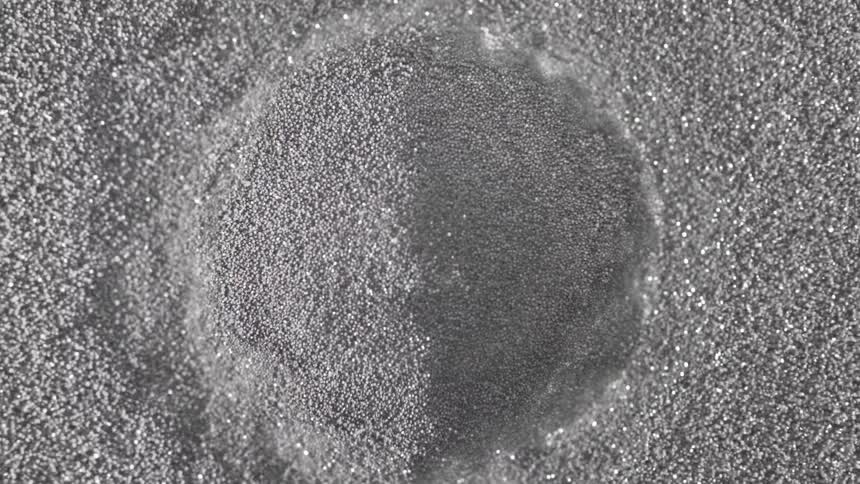 Dust like particles rippling like a liquid