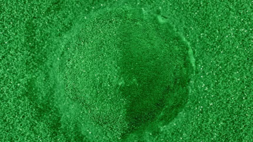 Bright green particles splashing up