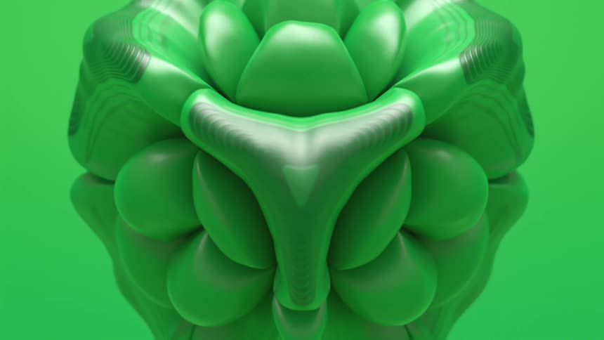A green soccer ball spontaneously expands and inflates into sections