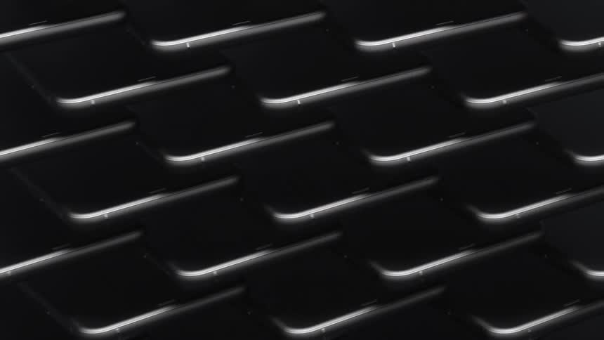 The edge of stacked cellphones swinging left and right
