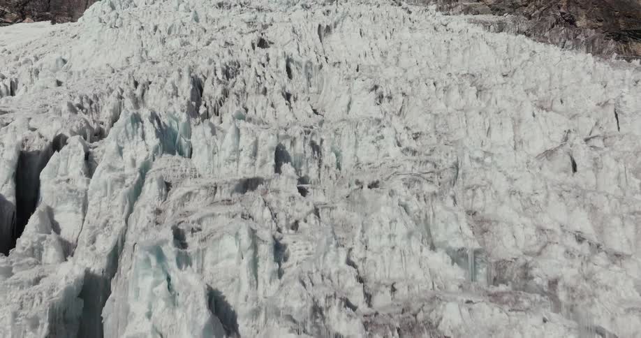Aerial view of the jagged surface of a glacier