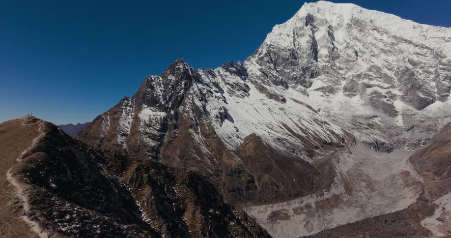 Aerial scenery of peaks cliffs and mountains with snow