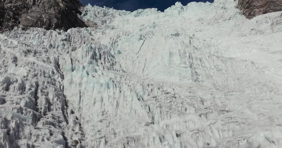 Rocky wall with snow and cliffs of a mountain