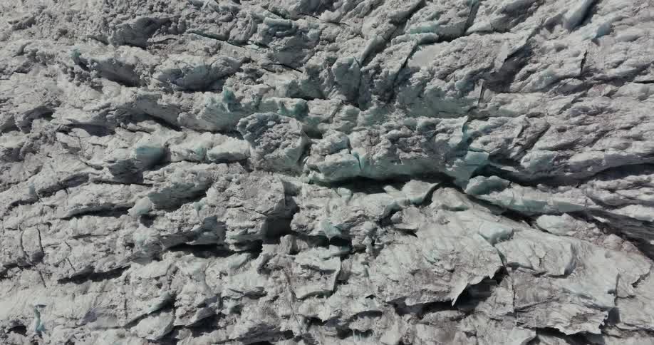 Top view of snowy rock deformations of a mountain