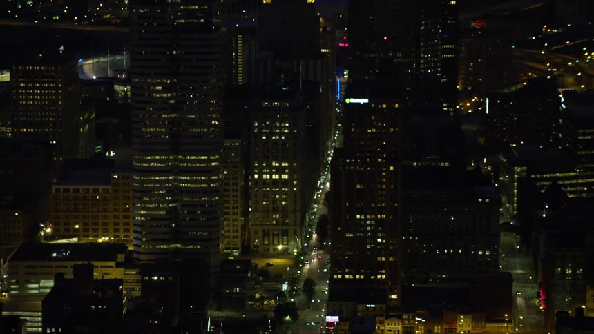 Aerial of metropolitan city lit up at night