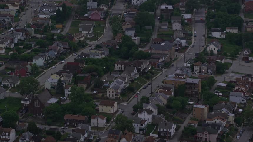 An aerial view of a residential neighborhood at dusk