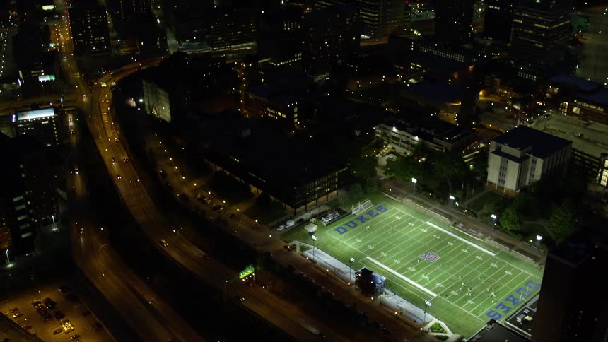 A football stadium is in the middle of the city