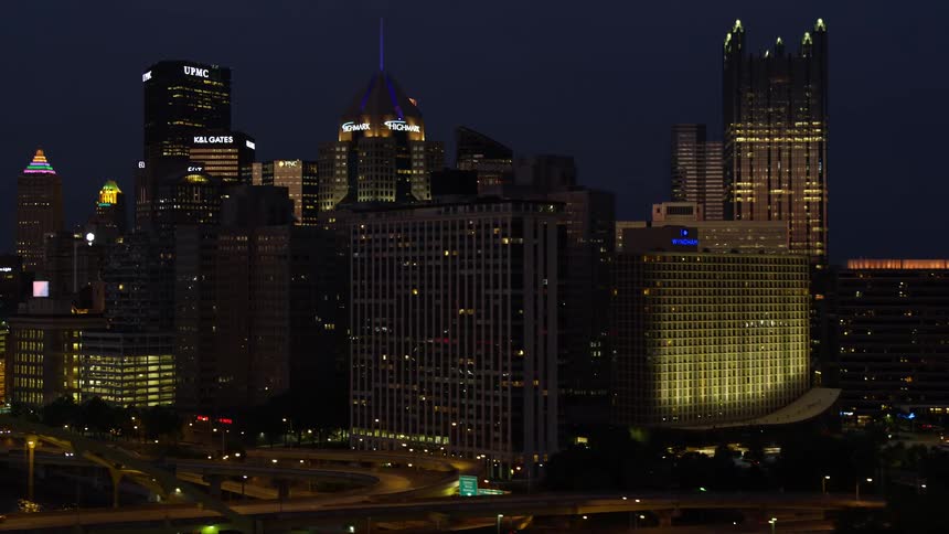 Tall skyscrapers in the city during the night time