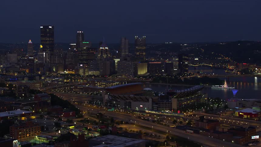 Panoramic and aerial scenery of a metropolitan city with seaside skyscrapers at night