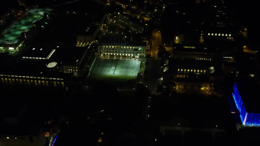 Aerial panorama of a metropolis with buildings and urban areas at night