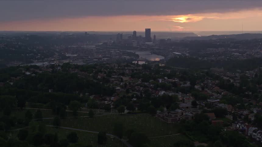 An aerial view of a city at sunset
