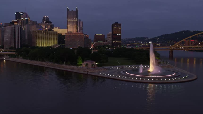 Cars drive over the bridge into the city