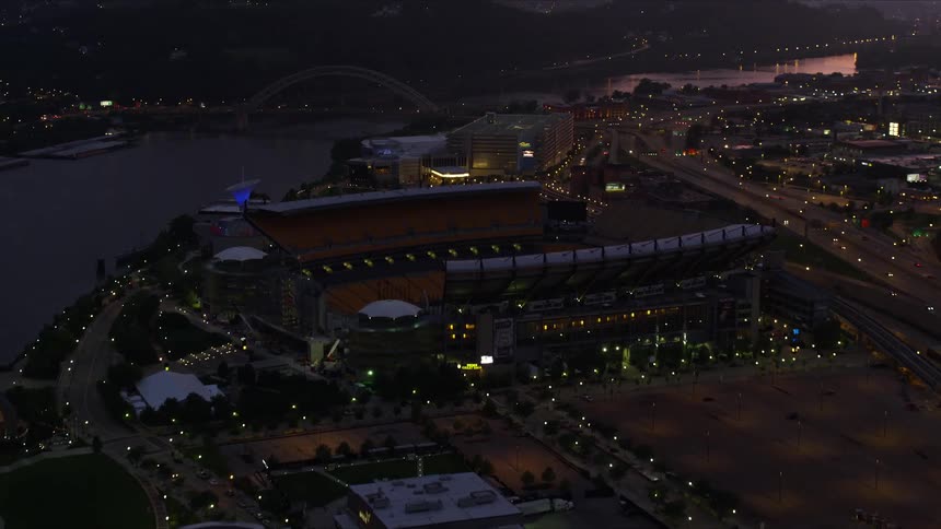 A stadium is on the shore line of the city