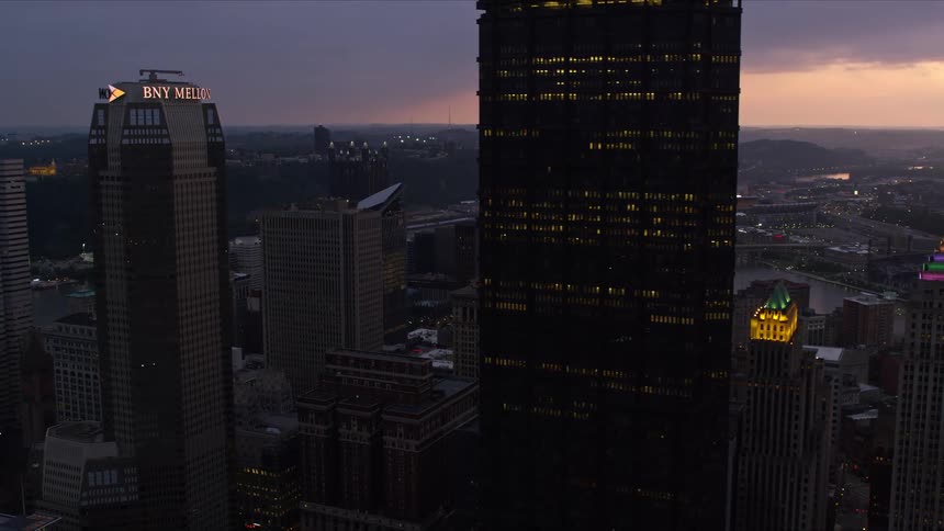 Modern skyscrapers in a seaside metropolis on a purple morning