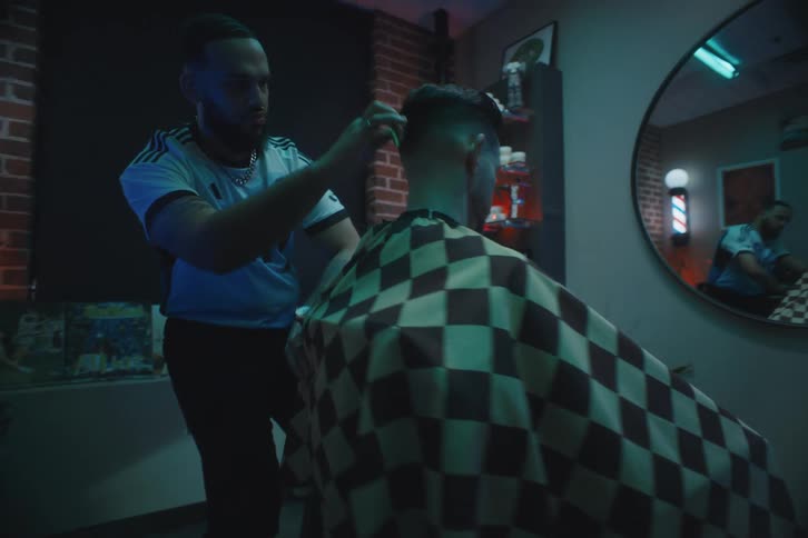 A barber giving a client a haircut