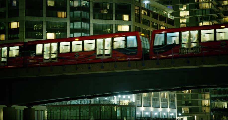 A train crossing an overpass in a metropolitan city