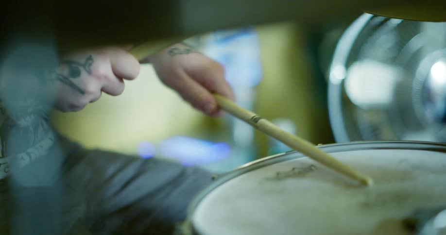 Close up of a drummer hitting a snare drum
